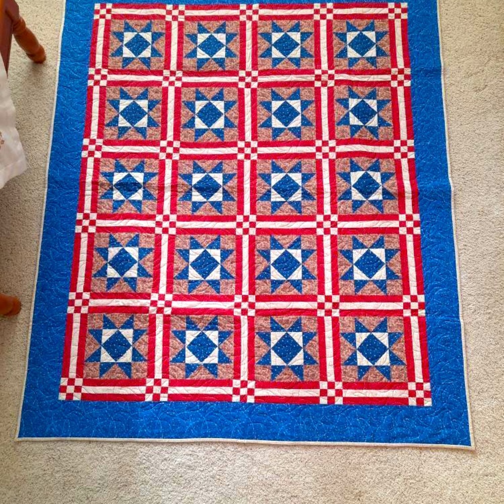 Handmade quilt. 61x72 quilted with variegated red, white and blue thread.